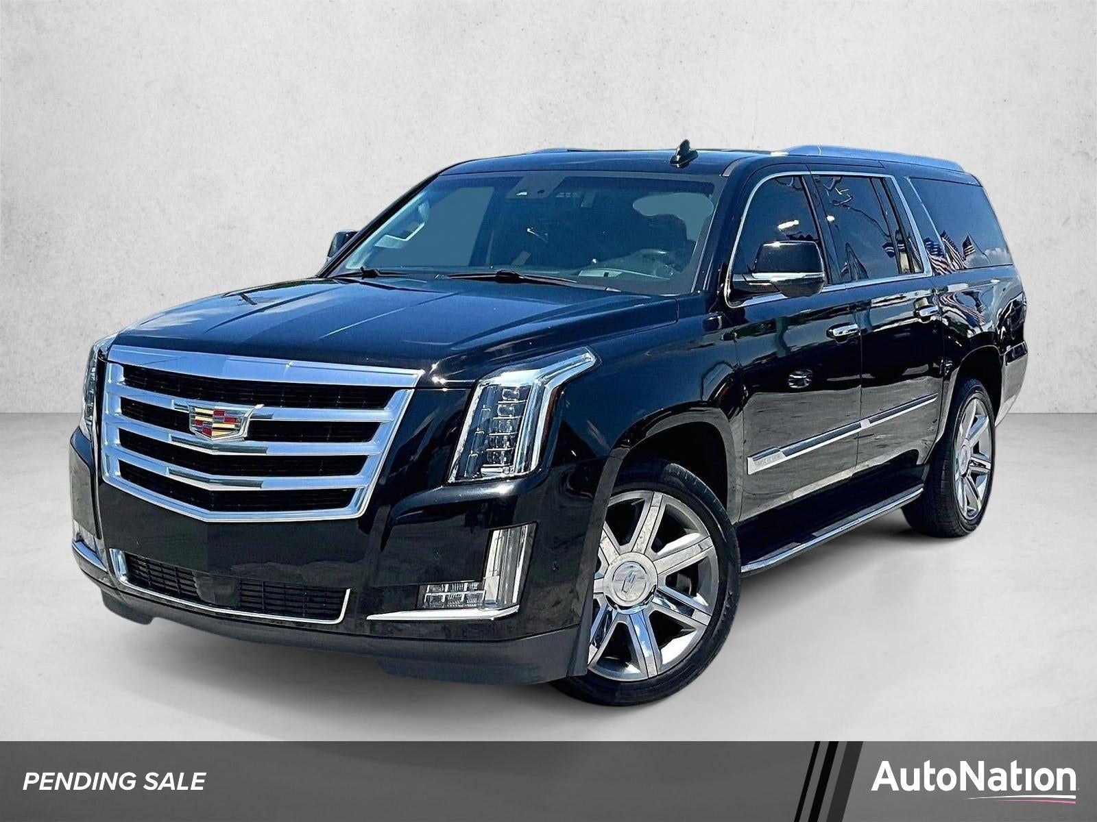 2017 Cadillac Escalade ESV Luxury in Black Raven — front three-quarter view