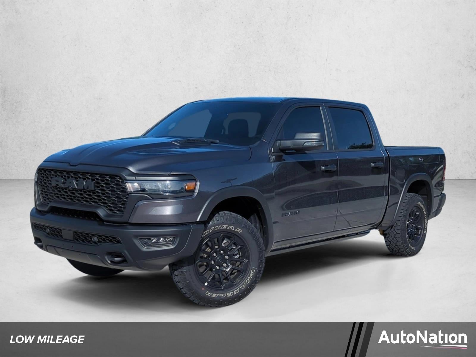 2026 RAM 1500 Rebel 4x4 Crew Cab 5'7" Box in Granite Crystal Metallic Clearcoat — front three-quarter view
